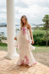 Brunette model wearing the Rova Tiered Gown in Cream & Pink Floral content shot