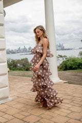 Blonde model wearing the Sola Tiered Maxi Dress in Brown Polkadot content shot