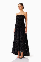 Brunette model wearing Selena Strapless Maxi Dress in Black side shot