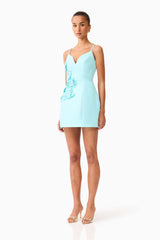 Brunette model wearing the Stella Tulip Mini Dress in Aqua Blue side shot 
