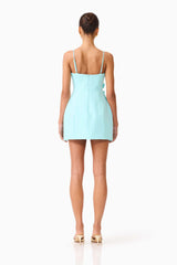 Brunette model wearing the Stella Tulip Mini Dress in Aqua Blue back shot 