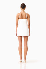 Brunette model wearing the Stella Tulip Mini Dress in White back shot 