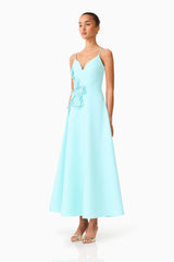 Brunette model wearing the Stella A-Line Gown in Aqua Blue side shot 