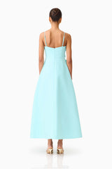 Brunette model wearing the Stella A-Line Gown in Aqua Blue back shot 