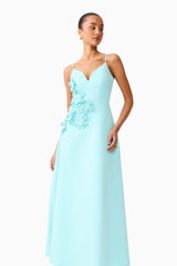 Brunette model wearing the Stella A-Line Gown in Aqua Blue posed side shot 