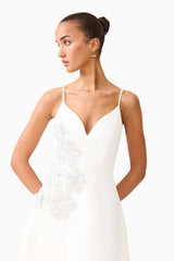 Brunette model wearing the Stella A-Line Gown in White close up shot 