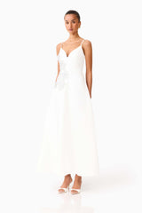 Brunette model wearing the Stella A-Line Gown in White side shot 