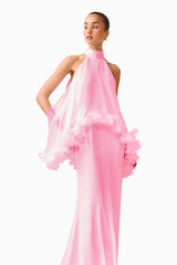 Brunette model wearing the Poppy Cape Gown in Pink posed side shot 