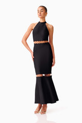Brunette model wearing the Naomi Halter Gown in Black posed shot 