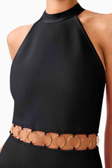 Brunette model wearing the Naomi Halter Gown in Black detail shot 