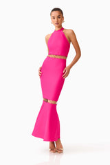 Brunette model wearing the Naomi Halter Gown in Raspberry Pink posed shot 