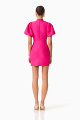 Brunette model wearing the Naomi Puff Sleeve Mini Dress in Raspberry Pink back shot 