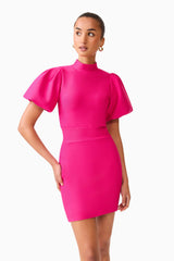 Brunette model wearing the Naomi Puff Sleeve Mini Dress in Raspberry Pink close up shot 