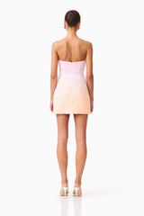 Brunette model wearing the Lumira Sequin Lace Mini Dress in Pink Ombre back shot 