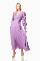 Blonde model wearing NECTAR 3D ROSETTE MAXI DRESS IN PURPLE front shot
