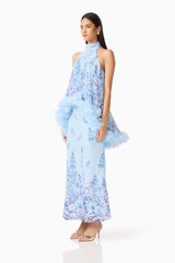 Brunette model wearing the Tulsia Floral Cape Maxi Dress in Light Blue side shot