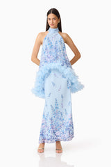 Brunette model wearing the Tulsia Floral Cape Maxi Dress in Light Blue posed shot