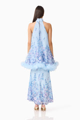 Brunette model wearing the Tulsia Floral Cape Maxi Dress in Light Blue back shot