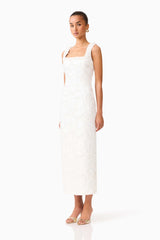 Brunette model wearing the Elowen Floral Applique Midi Dress in White side shot 