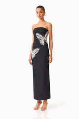 Brunette model wearing the Mira Strapless Gown in Black side shot