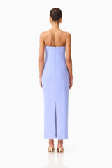 Brunette model wearing the Mira Strapless Gown in Blue back shot