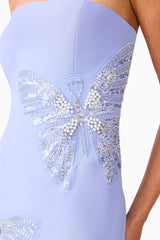 Brunette model wearing the Mira Strapless Gown in Blue detail shot