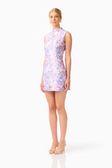 Blonde model wearing the Marlene Shift Mini Dress in Pink & Lilac Floral side shot