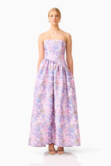 Blonde model wearing the Marlene Asymmetrical Gown in Pink & Purple Floral front shot