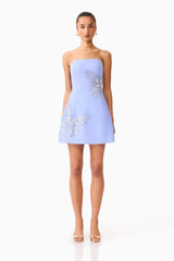 Brunette model wearing the Mira Strapless Mini Dress in Blue front shot 