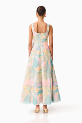 Brunette model wearing the Taliah A-Line Gown in Blue Multi back shot