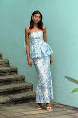 Brunette model wearing the Kalissa Strapless Gown in Blue Floral influencer shot 