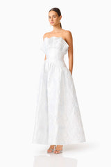 Brunette model wearing the Laurel Sleeveless Maxi Dress in Silver side shot