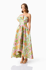 Brunette model wearing the Laurel Sleeveless Maxi Dress in Green Floral side shot