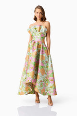 Brunette model wearing the Laurel Sleeveless Maxi Dress in Green Floral posed shot