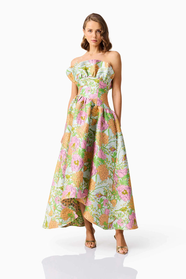Brunette model wearing the Laurel Sleeveless Maxi Dress in Green Floral posed shot