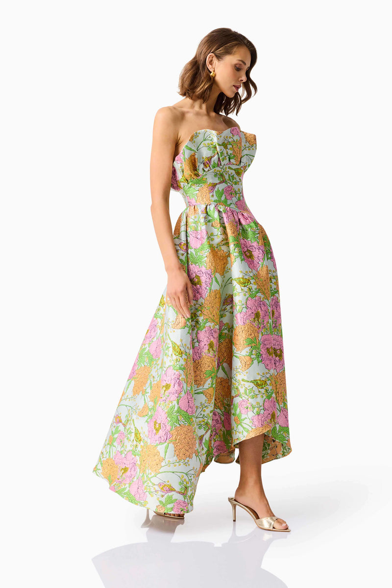 Brunette model wearing the Laurel Sleeveless Maxi Dress in Green Floral posed looking away shot