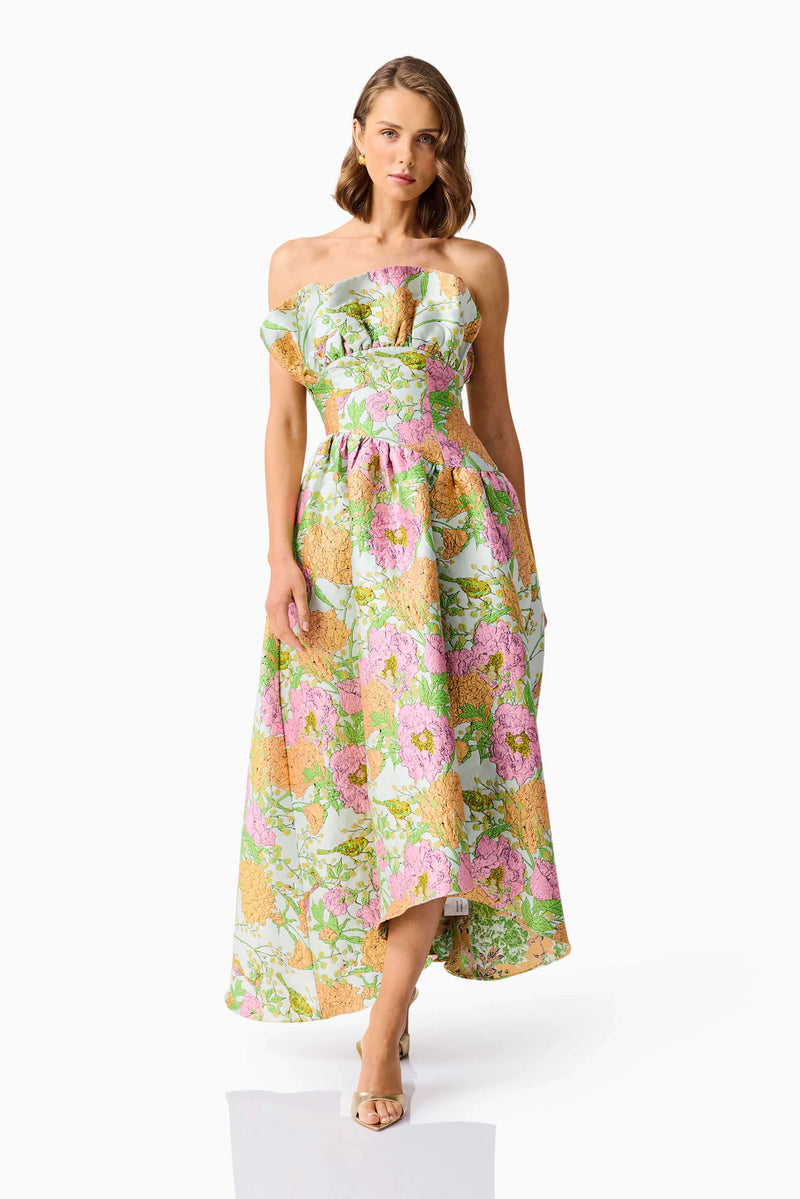 Brunette model wearing the Laurel Sleeveless Maxi Dress in Green Floral front walking shot