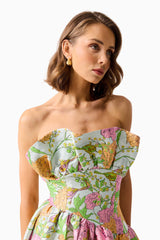 Brunette model wearing the Laurel Sleeveless Maxi Dress in Green Floral close up shot