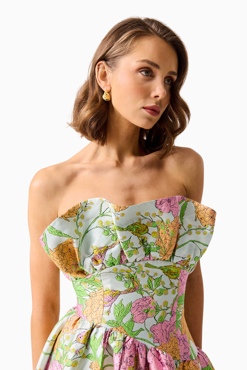 Brunette model wearing the Laurel Sleeveless Maxi Dress in Green Floral close up shot