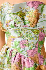 Brunette model wearing the Laurel Sleeveless Maxi Dress in Green Floral detail shot