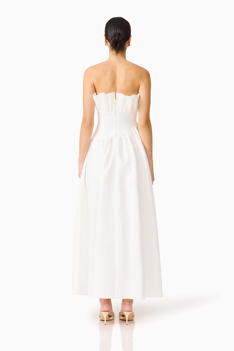 Brunette model wearing the Laurel Sleeveless Maxi Dress In White back shot 