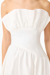Brunette model wearing the Laurel Sleeveless Maxi Dress In White detail shot 