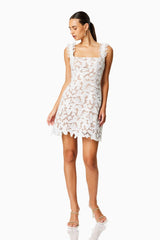 Brunette model wearing PINE LACE MINI DRESS in WHITE front shot