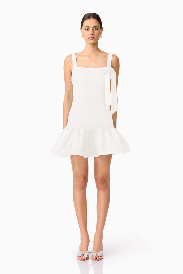 Brunette model wearing Dandelion Mini Dress in White front shot