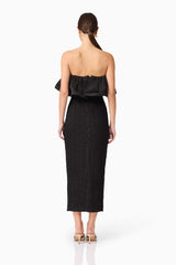 Brunette model wearing Dandelion Strapless Midi Dress in Black back shot