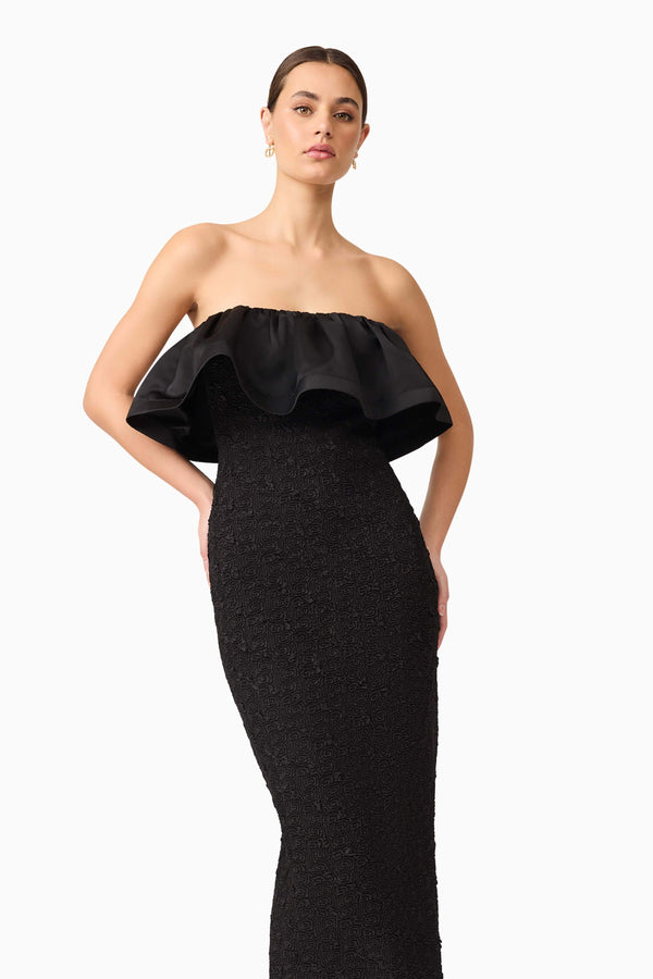 Brunette model wearing Dandelion Strapless Midi Dress in Black close up posed shot