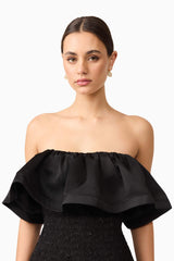 Brunette model wearing Dandelion Strapless Midi Dress in Black detail shot