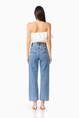 Brunette model wearing Dandelione Strapless Top in White back shot