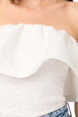Brunette model wearing Dandelione Strapless Top in White detail shot