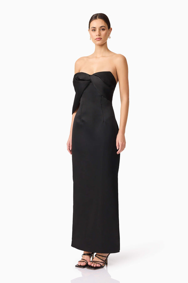 Brunette model wearing Dandelione Strapless Gown in Black side shot